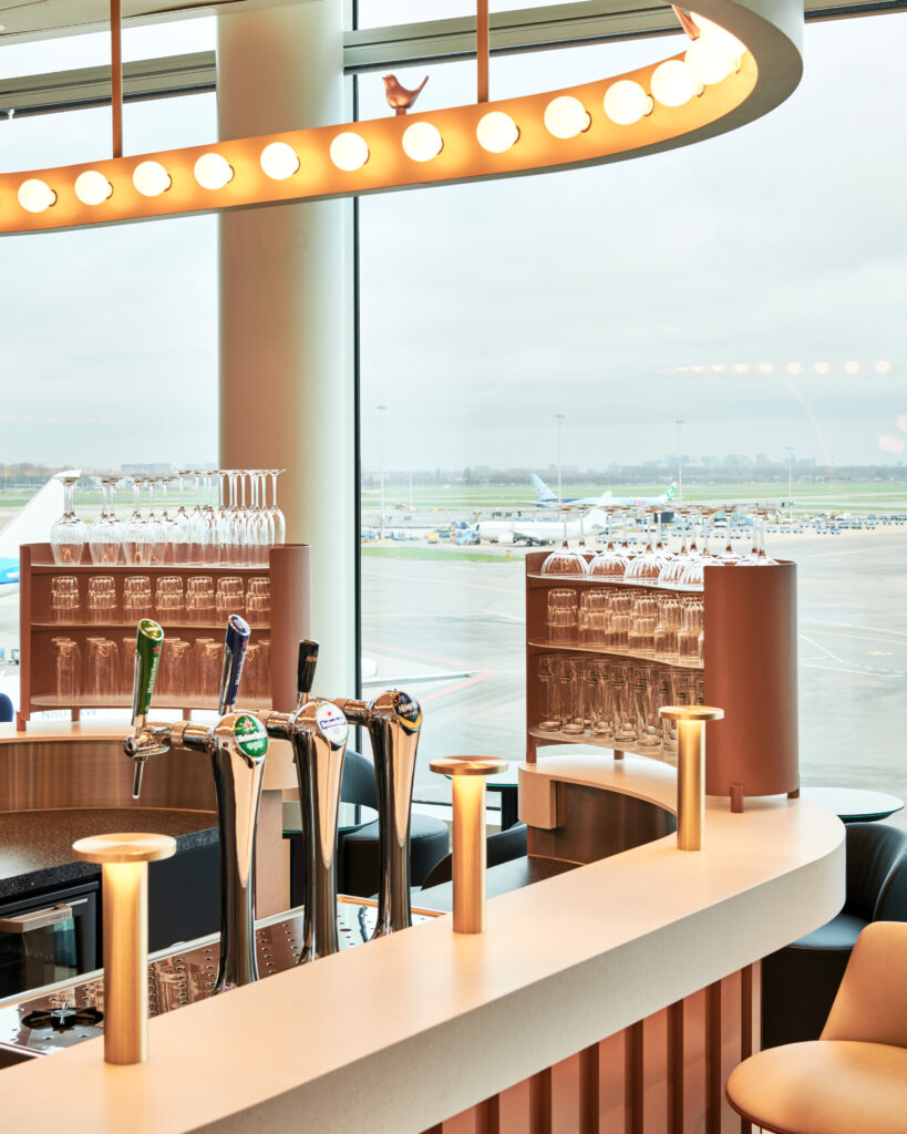 A bar with a view of the airport in the oneworld alliance's European lounge in Amsterdam Airport Schiphol