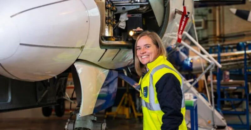 Pictured: Christine Holmes, Principal Mechanical Design Engineer, Cranfield Aerospace Solutions is seen working on an aircraft.