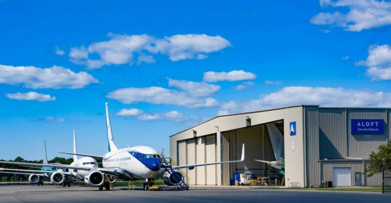 ALOFT AeroArchitects' hangar facility on a blue sky day.