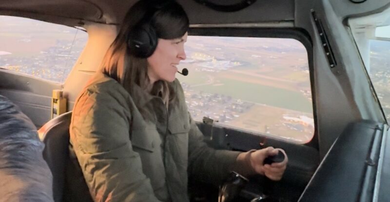 Stephanie Gehman, mom and soon to be pilot is in-flight on a blue sky day.