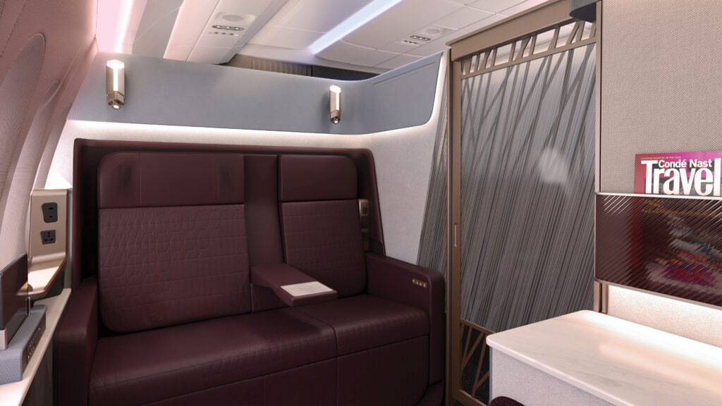 JAL A350-1000 Cabin Interior by Tangerine Ltd pictured here is the first class suite that includes an large maroon seat that can accommodate two people. f