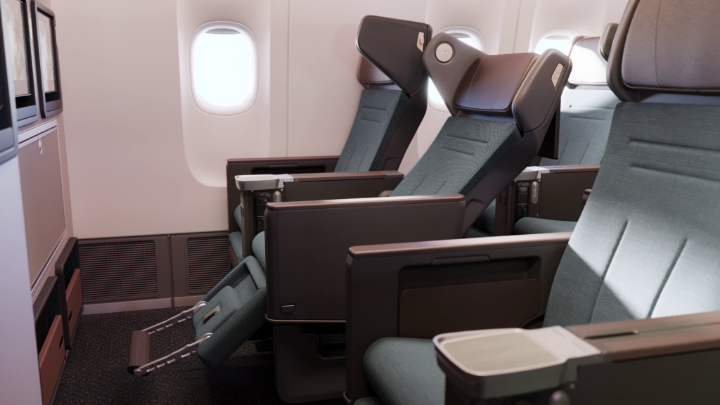 Cathay Pacific new Premium Economy seat in reclined position, with a warm palette.