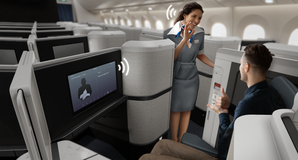 ADAPT system by Collins Aerospace shows wifi icons next to the flight crew member's head as she communicates with a male passenger in the aircraft cabin. 