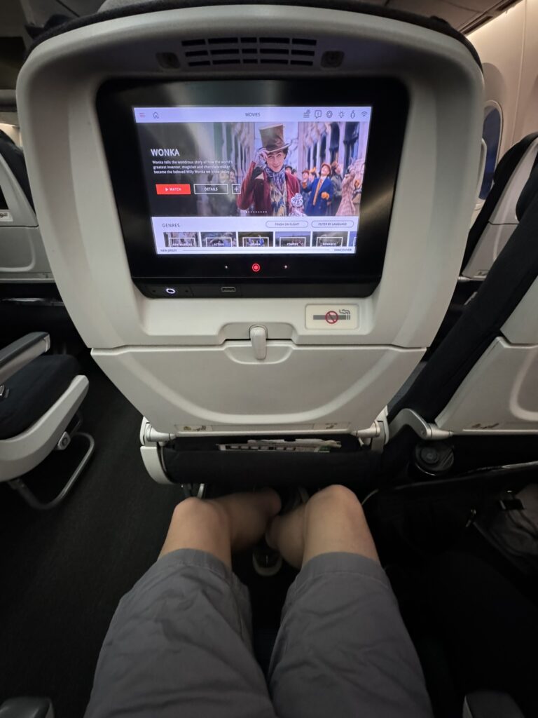 Air Canada's Boeing 787 economy class. The seated man has legroom.