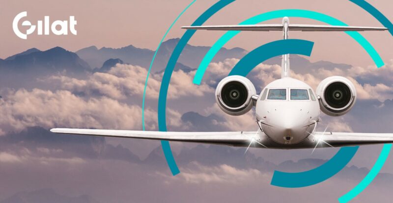 An aircraft in flight. Blue semi-circle lines encompass the aircraft. The Gilat logo is in the top left corner.
