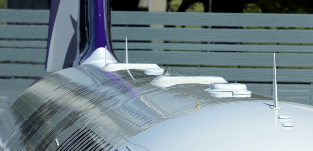 The two Starlink terminals blend in to the collection of antennae atop a Hawaiian A321neo