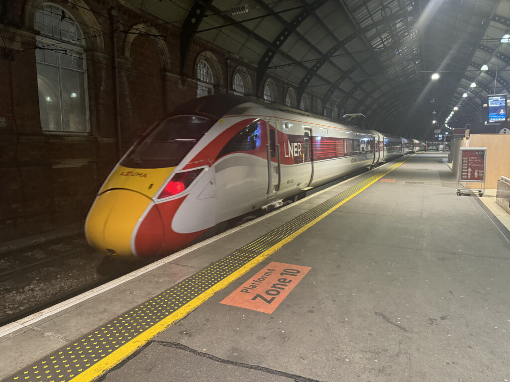 The LNER train is pulling into the station. 