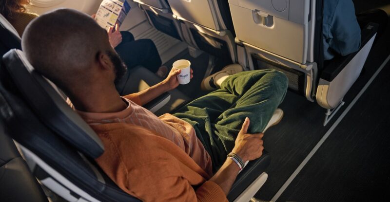 A passenger is sitting in Alaska Airlines Premium Class