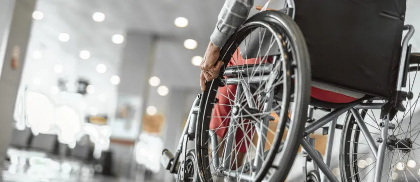 Accessibility is so important. In this image, an elderly lady is using a wheelchair at the airport. The DOT is among the world's safety regulators advancing protections for wheelchair users.