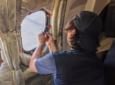 An engineer is installing AirFi LEO on an aircarft.