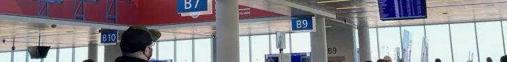 Airport gate area is crowded with people