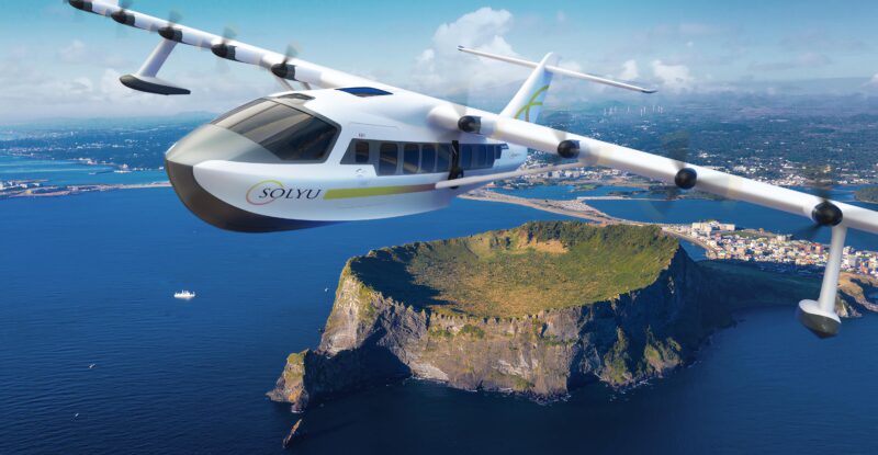 A rendering of the Solyu JEKTA PHA-ZE 100 amphibious aircraft flying over an island.