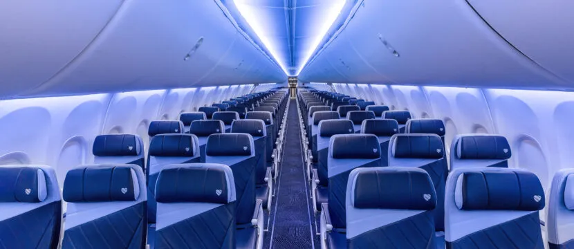 The blue Southwest cabin interior is enhanced by LED lighting.