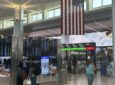 Passengers watch the screens at Newark Liberty