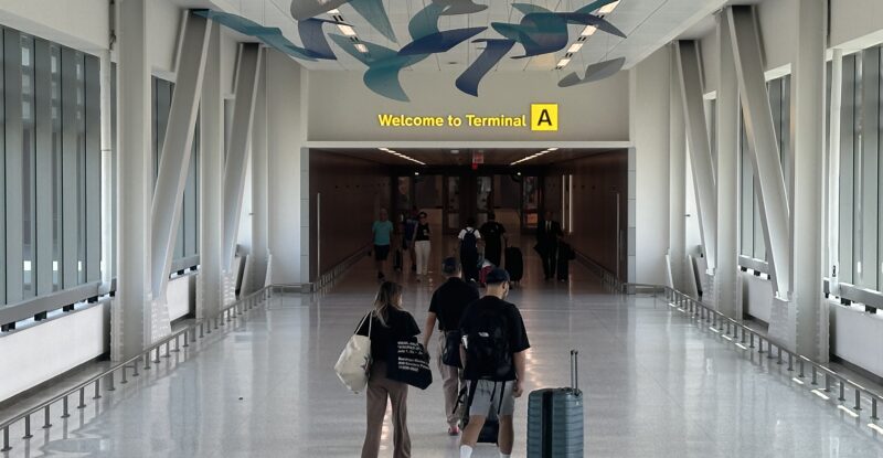 Passengers walking through towards a terminal
