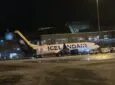 Icelandair 737 MAX at the airport at night.
