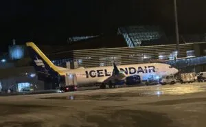 Icelandair 737 MAX at the airport at night.