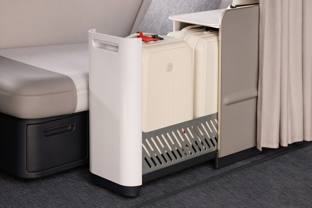 A large sliding drawer accommodates up to two carry-on suitcases