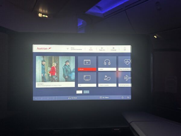 IFE screen GUI with films, TV programs, audio and other content highlighted 