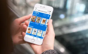 ITA Airways' app with Media Carrier's digital titles displayed on a mobile device.