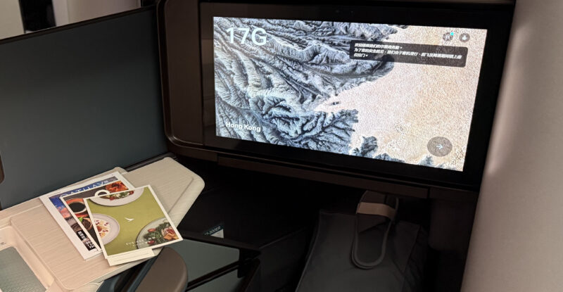 A large IFE screen is showing a welcome screen.