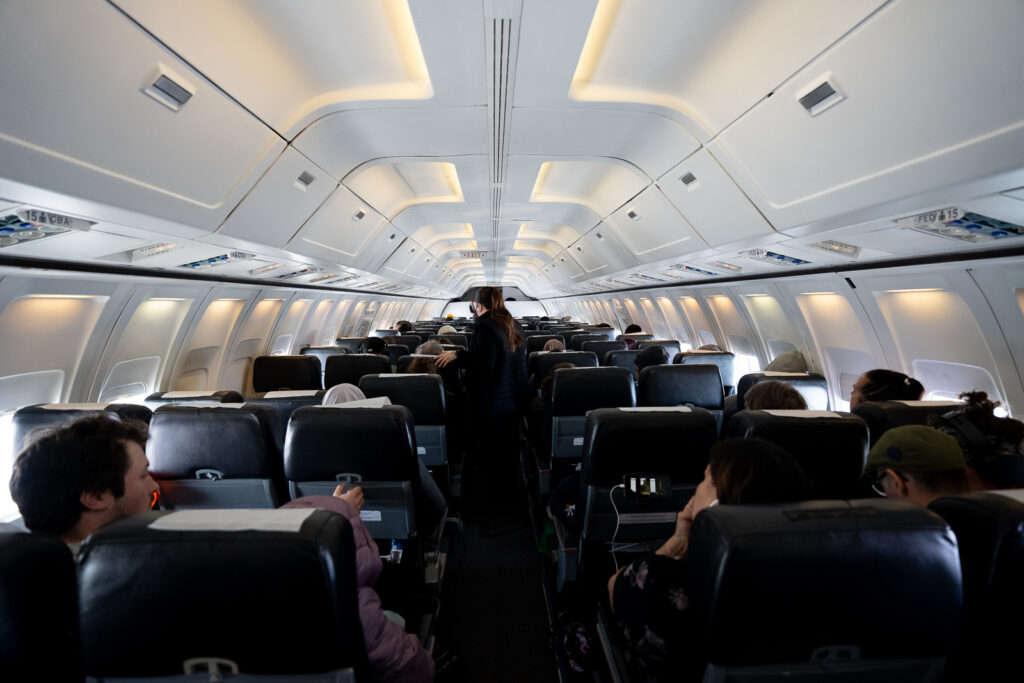 Air Inuit aircraft in a 3-3 configuration with a cabin full of passengers.