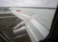 Wing of Air Inuit 737 as seen through a cabin window