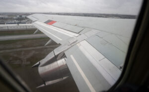 Wing of Air Inuit 737 as seen through a cabin window