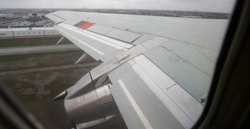 Wing of Air Inuit 737 as seen through a cabin window