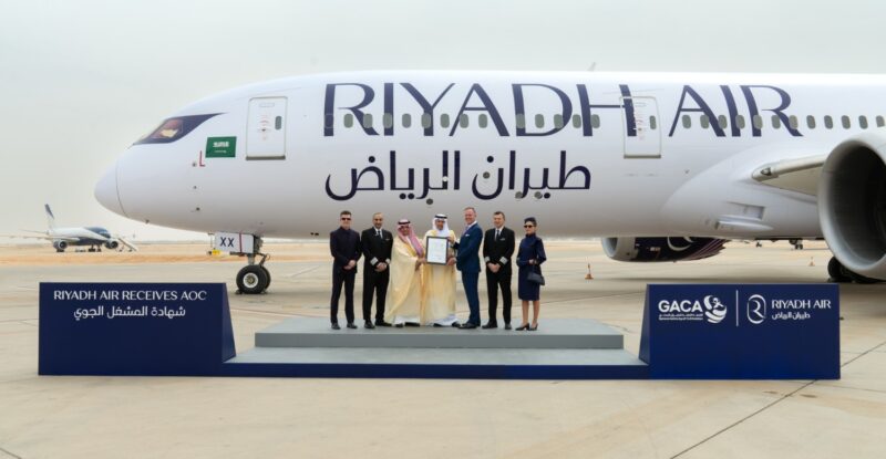 Riyadh Air aircraft with various executives in front of it for a photo