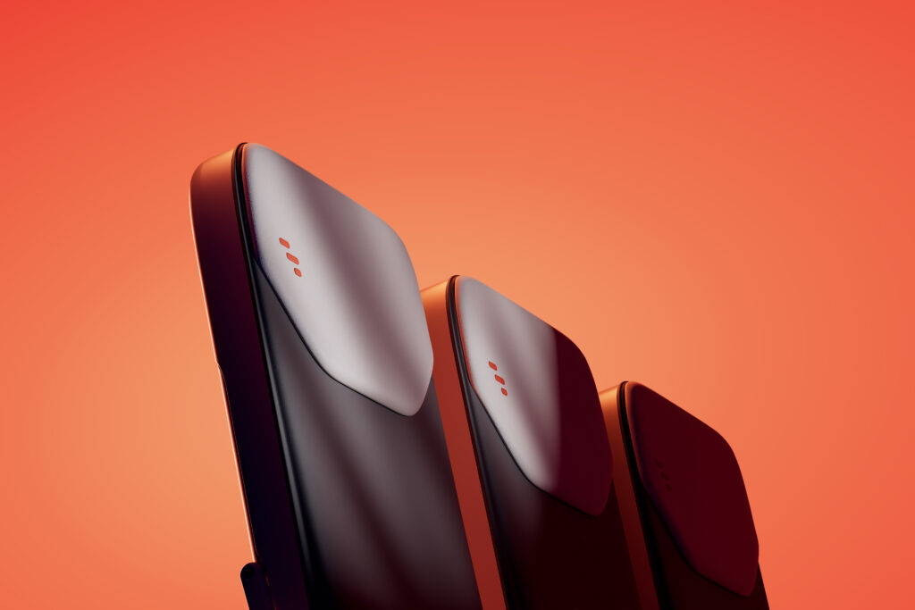 A close up of a dark seat triple on an orange background.