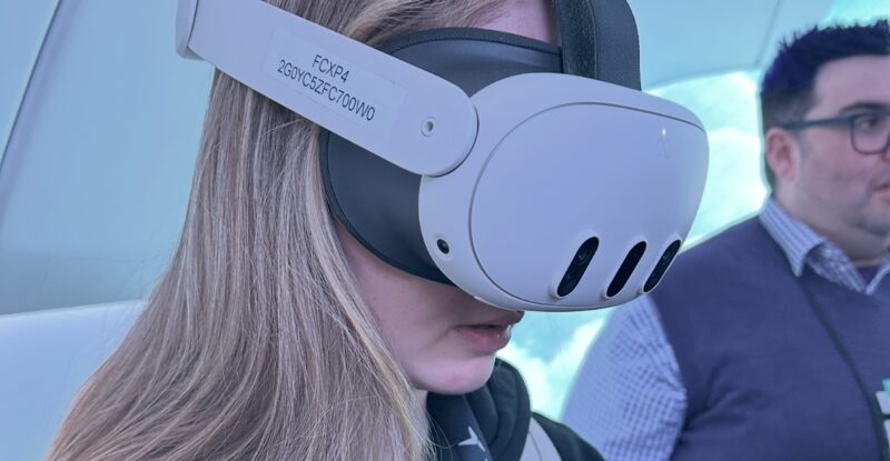 Woman uses AR on stand at Airbus