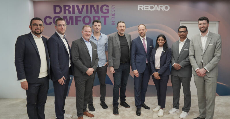RECARO Aircraft Seating and Azul executives posing for a photo at AIX 2025