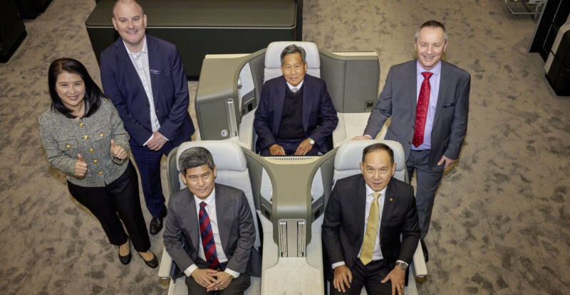Executives are sitting in the Vantage seat that will be featured on THAI