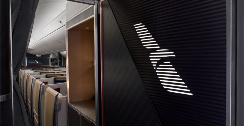 The entry to the Boeing 787-9 features a panel illuminated by American’s Flight Symbol, affirming our Flagship experience.
