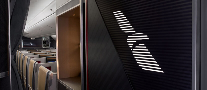 The entry to the Boeing 787-9 features a panel illuminated by American’s Flight Symbol, affirming our Flagship experience.