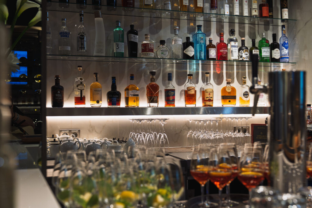 A large wall display of various spirits and liquors