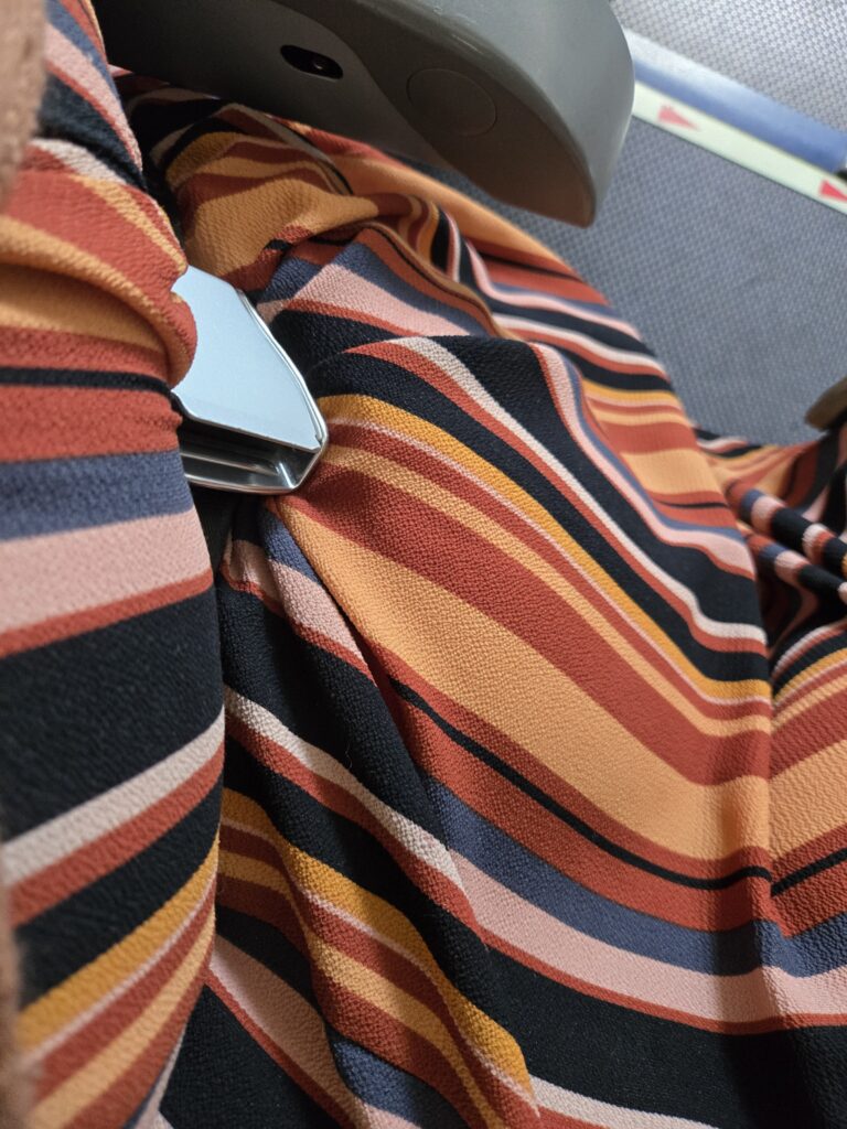 A seat belt is snug and tight on the passenger of the CRJ900