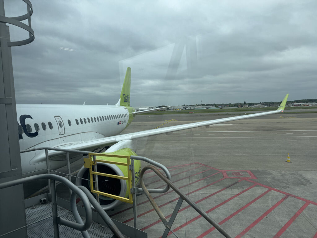 airBaltic A220, operated for Brussels Airlines, is parked and ready to board.
