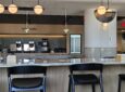 Air Canada Café lounge in Montreal with stools against a bar.