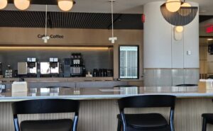 Air Canada Café lounge in Montreal with stools against a bar.