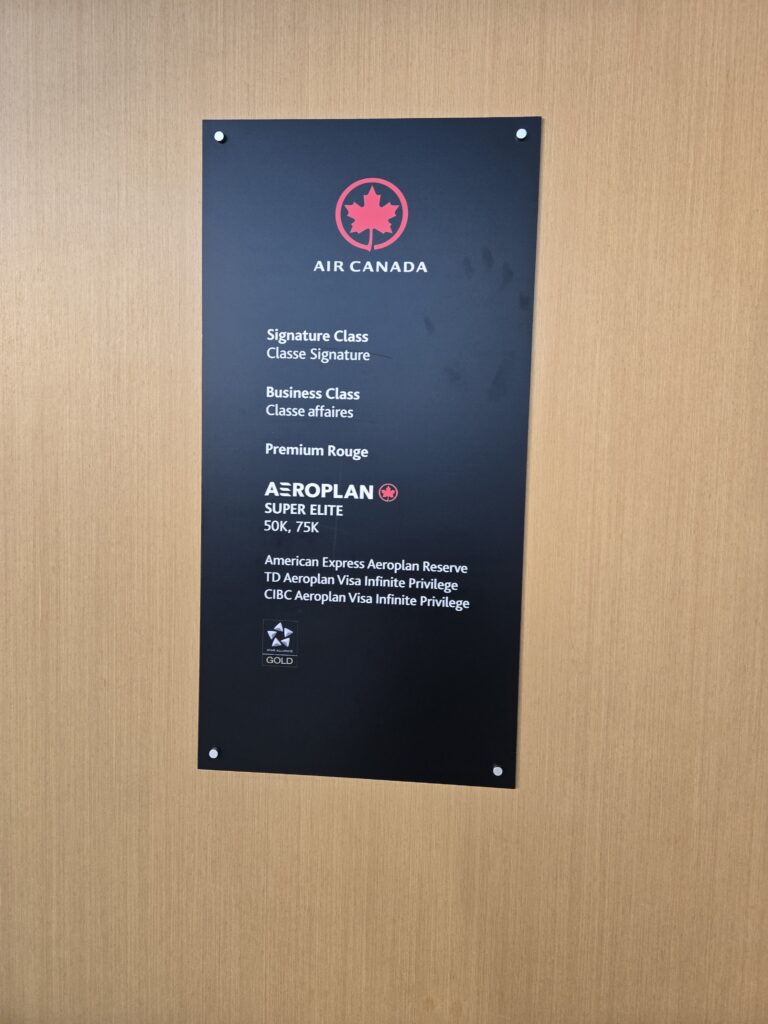 Air Canada Café entry requirements on a sign