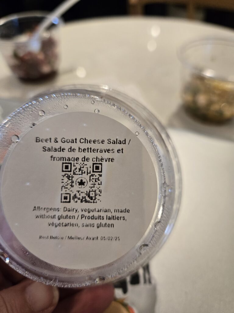 A close up of the QR code on a beet & goat cheese salad.