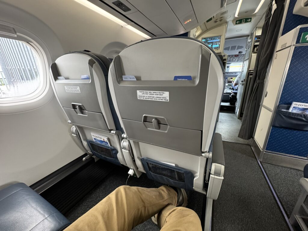 The author has plenty of space for his legs on this Porter flight aboard the E2. 