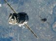 A satellite over the earth with Gilat logo to the upper left