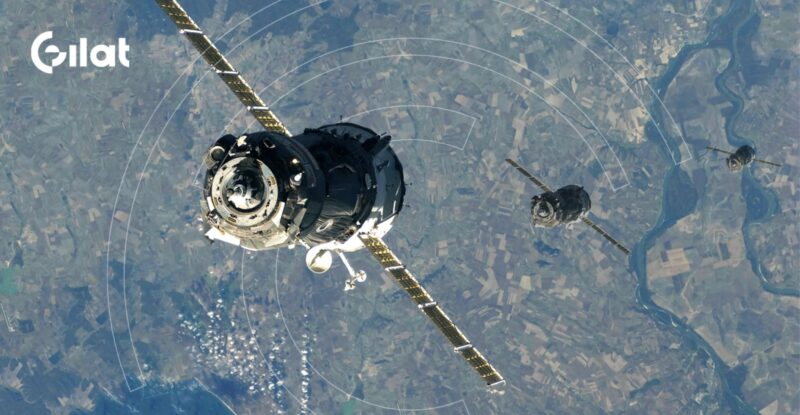 A satellite over the earth with Gilat logo to the upper left