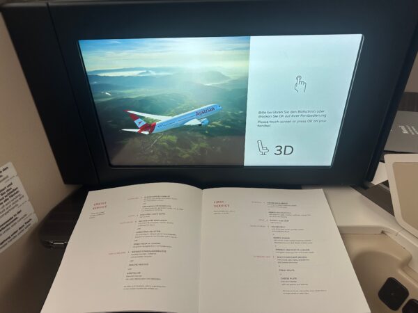 Menu is laid out on the bifold table of seat 3D. The large IFE screen says "3D"