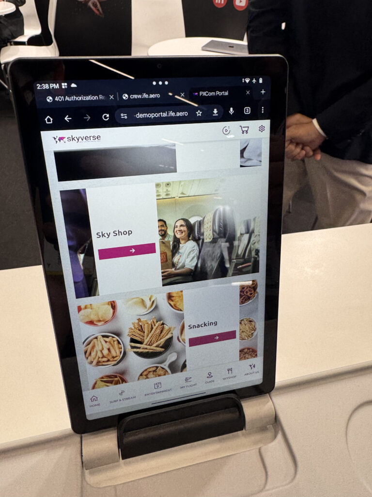 SkyVerse is being demoed on a tablet at AIX 2025. This page will take the user to a so-called Sky Shop or to a 'Snacking' menu.