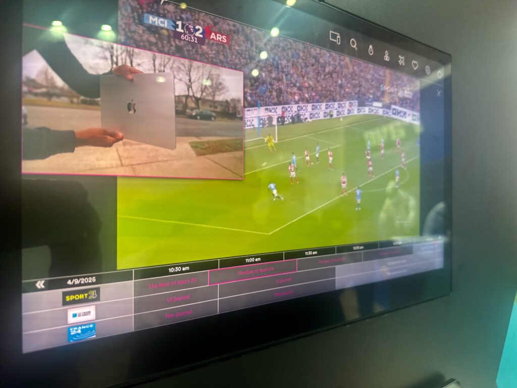 PIP demo with picture in picture being shown on the large Safran Passenger Innovations RAVE IFE screen, on SPI's stand at AIX 2025. The firm's new casting solution enables PIP including with the passenger's own PED device content.