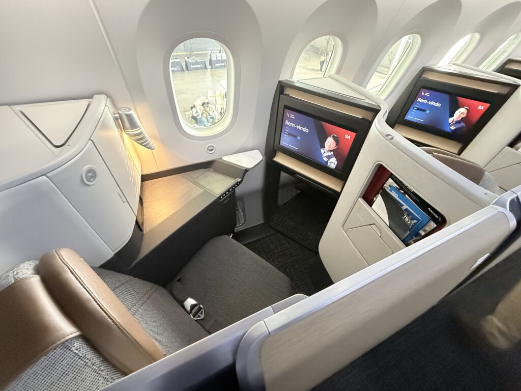 Overhead view of regular Flagship Suite on the 787-9 with lighter CMF, including grey seat and tan headrest.